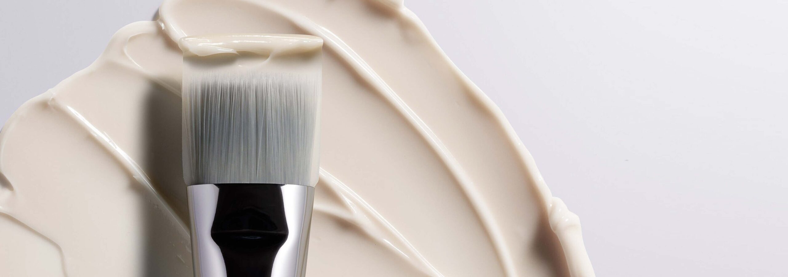 Close-up makeup brushes applying product